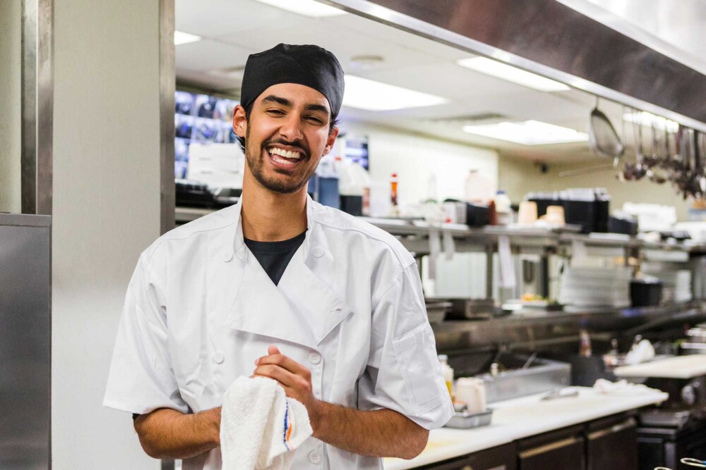 man in business casual shirt smiling